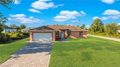 Single story home featuring an attached garage, st