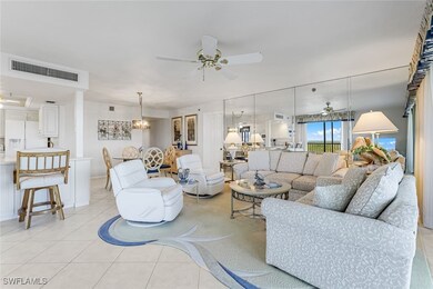 Living area with ceiling fan, light tile patterned