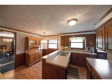 Kitchen with laminate flooring.