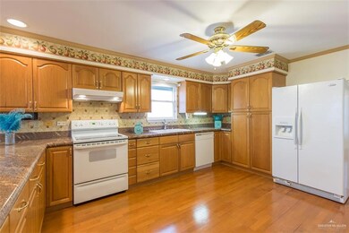All the appliances go with the home.  The kitchen is a center point on this home and the garage and bedrooms are just off the kitchen.  