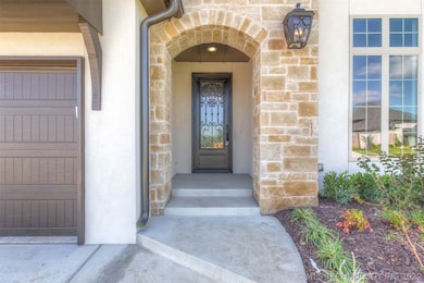 A large and inviting iron & glass door welcomes yo