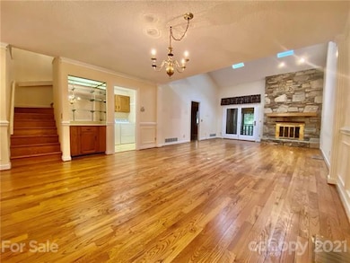 Spacious Great Room with Vaulted Ceiling and Rock Fireplace