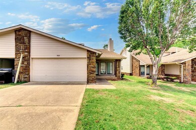 Ranch-style house with a front lawn and a garage