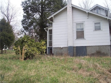 Looking from middle of lot to house next door