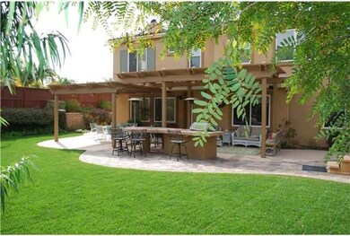 Looking back at the rear of the house from the large grassy area.