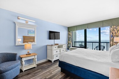 Bedroom with baseboards, lvp floors, and access to