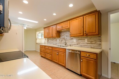Kitchen view featuring updated cabinets and tile backsplash
