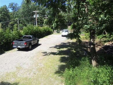 The lower gated lot located next to the house offe