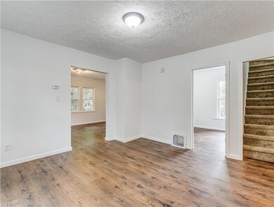 dining room with doorway to upstairs, bedroom, and