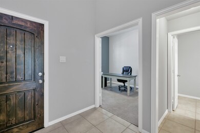 If you look to the left you will see an office or it can be an additional bedroom since there is a closet. If you walk a bit further there is a half bath to your left.