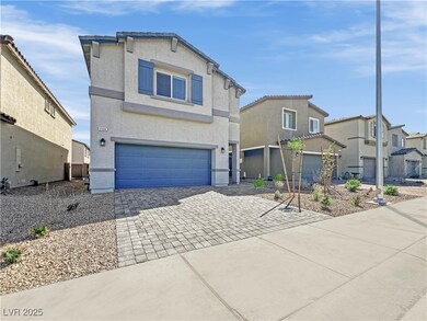 Traditional home with decorative driveway, a resid