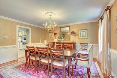 Dining Room has Hardwood Floors and Wainscoting