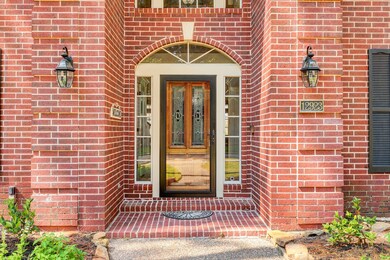 Approaching the font entry your eyes are drawn from the beautiful landscaping to the intricate, rich colors of the brickwork. Updated sconces provide ample lighting, and the lovely wooden front door is equipped with smart locks, providing you both security and convenience.