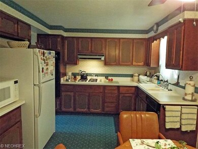 Kitchen has plenty of cabinetry, counter space, ea