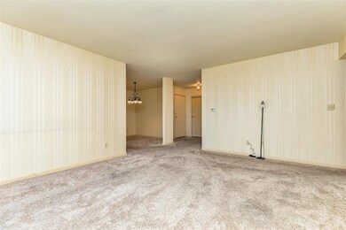 View from corner of living room with DR and entry.