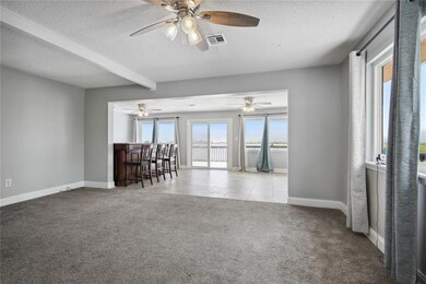 Large living room, opens into dining room and bar.