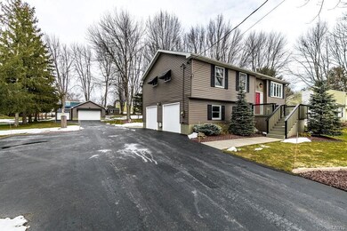 Long driveway leads back to heated garage...