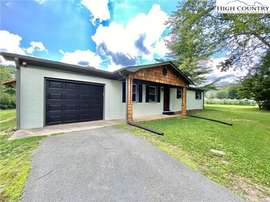 Paved driveway to the attached garage and nice fla