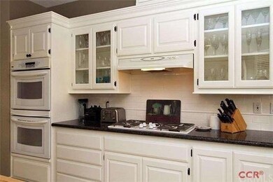 Ã¢â‚¬Â¢Granite counters in kitchen, white cabinets