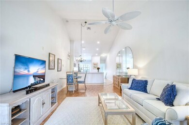 Living area with visible vents, high vaulted ceili