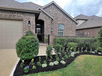 Lush landscaping in both the front and backyards. The front yard is maintained by the HOA. Security gate is perfect for that extra level of safety.