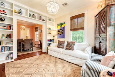 Living room has built in bookshelves.