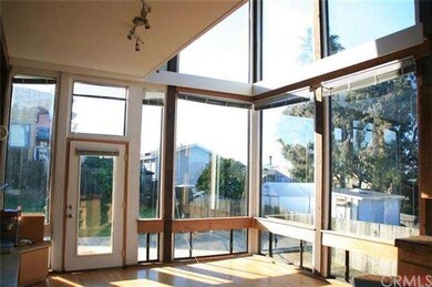 View from kitchen toward dining room with full wal