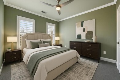 Bedroom with carpet, baseboards, ceiling fan, visi