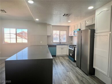 Kitchen featuring stainless steel appliances, a te