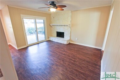 Family Room has a Wood Burning fireplace and acces
