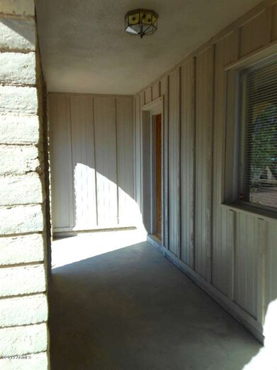 covered and partially enclosed patio