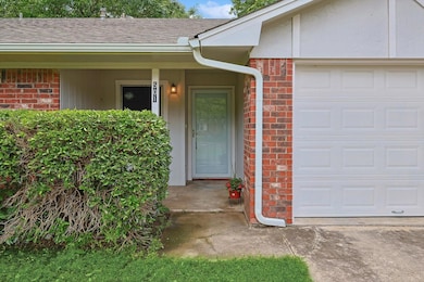 Property entrance featuring a garage