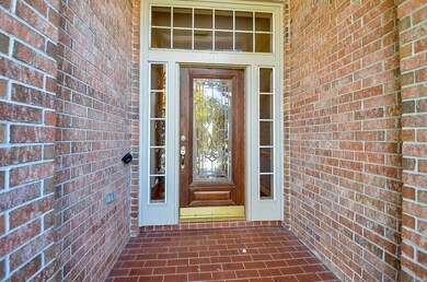 A beautiful brick-paved entrance leading to the el