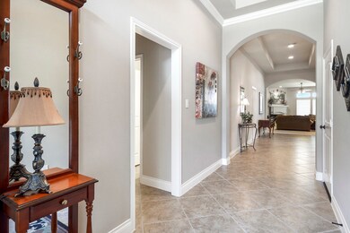 Beautiful grand entry with tall ceilings.