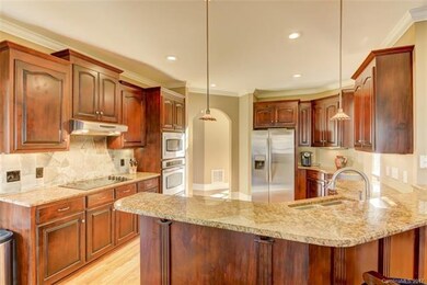 Beautiful kitchen with granite counters, stone bac