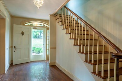 The lovely foyer offers a warm welcome. As you enter, the formal dining room is immediately to the right (left from this view) and formal living room to the left. The stairwell is rear facing.