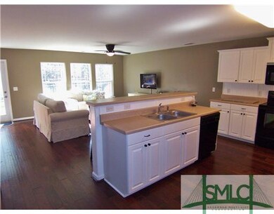 Kitchen. Kitchen features hardwoods throughout, bl
