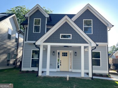 Charming welcoming Front porch, ceiling fan, wall mounted lanterns provides warm lighting of elegance.