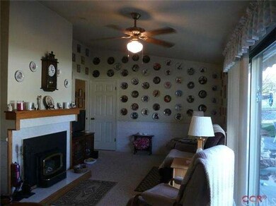 Family room with a wood burning fireplace insert a