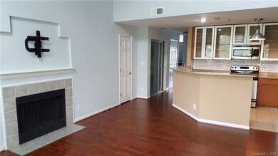 View from great room to kitchen and entry hall.