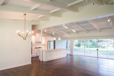 Open floor plan with floor to ceiling glass doors
