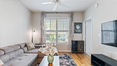 Living area featuring a textured ceiling, wood fin