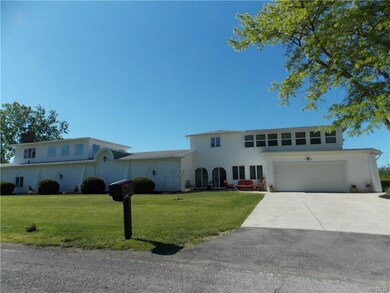 side view shows one of the attached two car garage