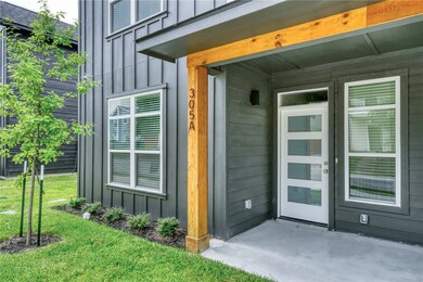 Property entrance featuring board and batten sidin