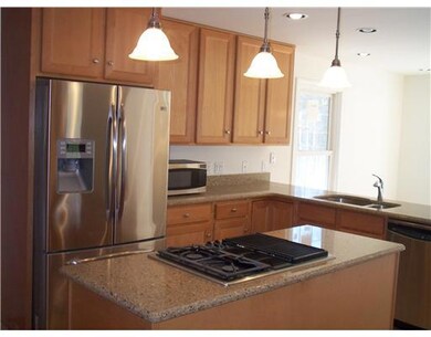 Kitchen. Granite Counters, JennAir Cooktop in Isla