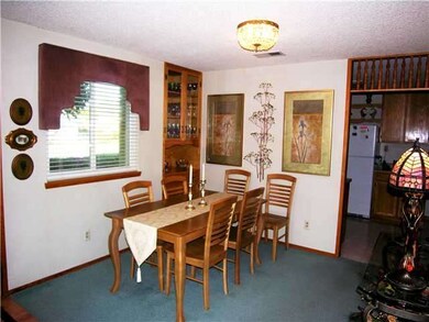 Neat-as-a-pin house has pleasant dining area.