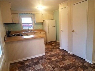Kitchen. Newly painted cabinets. Panty and coat cl