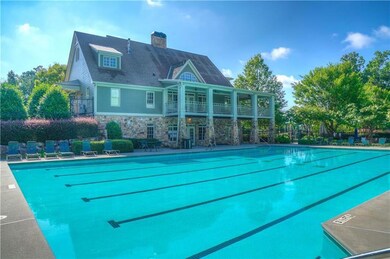 Community pool with a patio