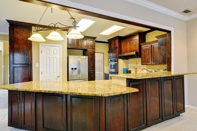 Large kitchen with expansive counter space and 2 l
