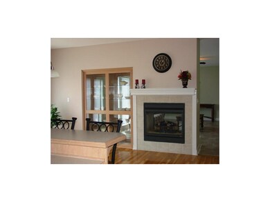 See Through Fireplace in Hearth Room with Built In